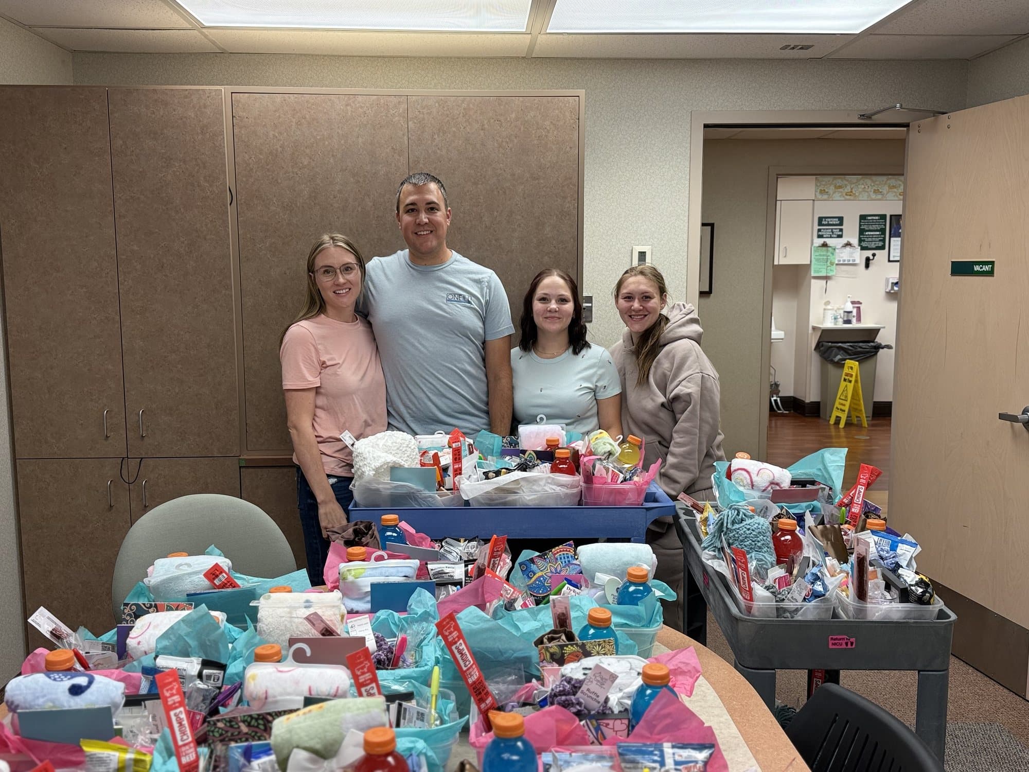 The 2025 delivery team with carts full of finished care baskets